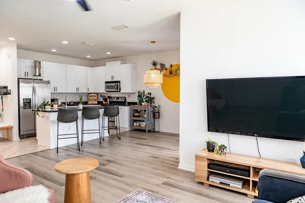 a living room with furniture and a flat screen tv