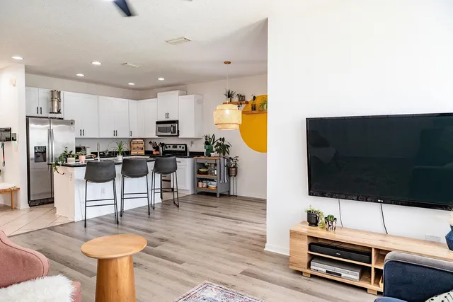 a living room with furniture and a flat screen tv