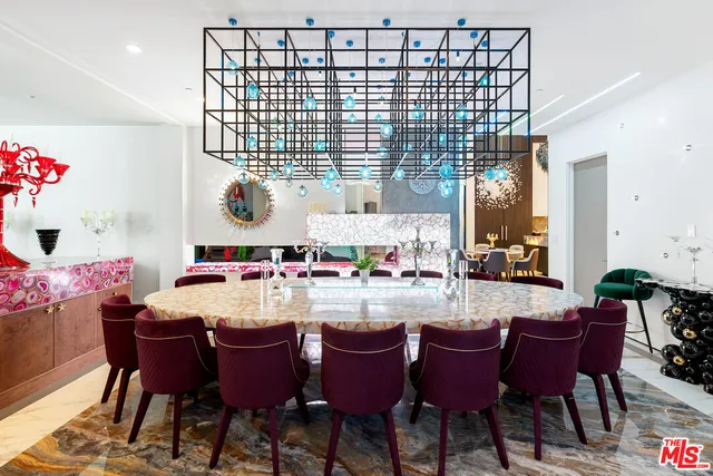 a living room with lots of furniture and a chandelier