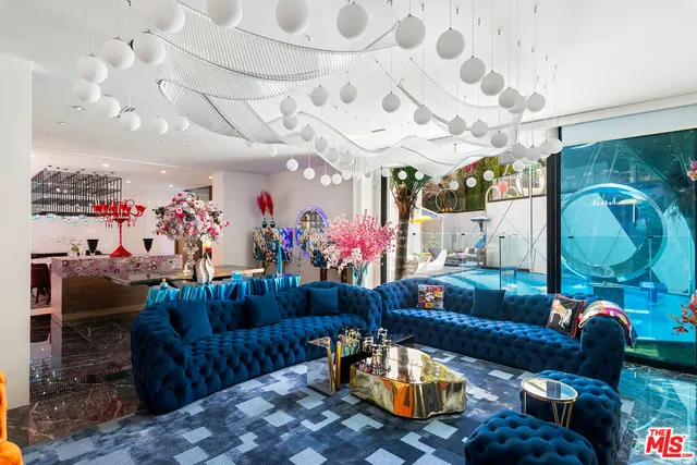 a view of a living room with clothes and shoes