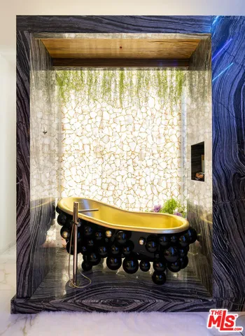 a living room with furniture windows and a flat screen tv