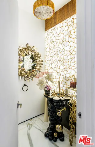 a view of outdoor kitchen with seating area