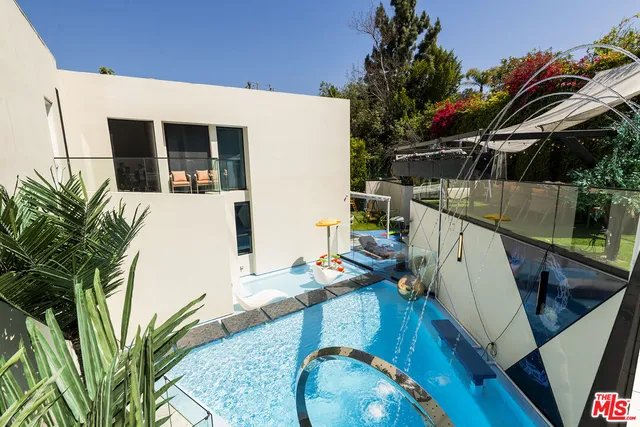 a view of a two chairs in the patio