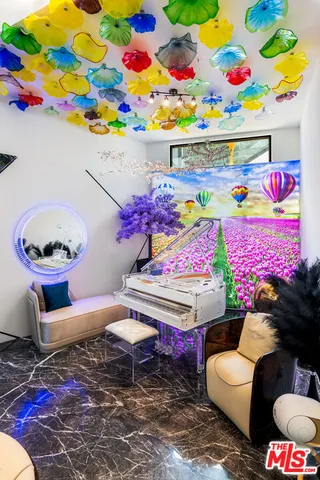 a view of bedroom with furniture and book shelf