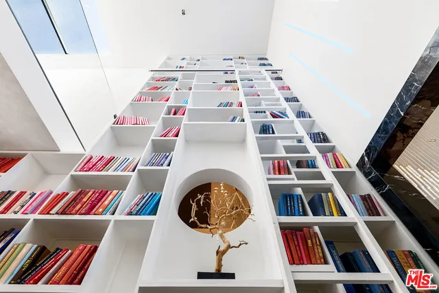a building outdoor space with patio furniture and potted plants