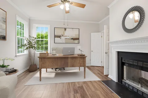 a living room with furniture and a fireplace