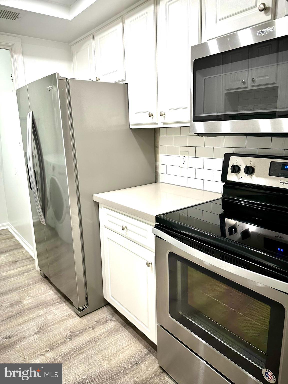 18334 Streamside Drive, Unit 202 Gaithersburg, MD 20879 - Photo 16 of 61 a kitchen with appliances and cabinets
