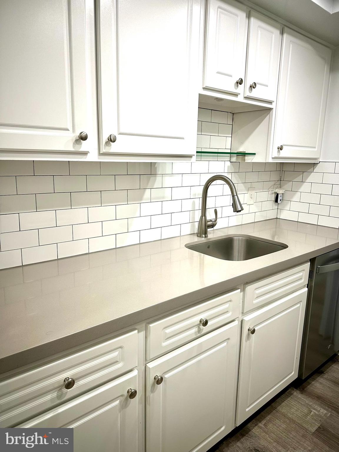 18334 Streamside Drive, Unit 202 Gaithersburg, MD 20879 - Photo 17 of 61 a close view of a kitchen sink with cabinets
