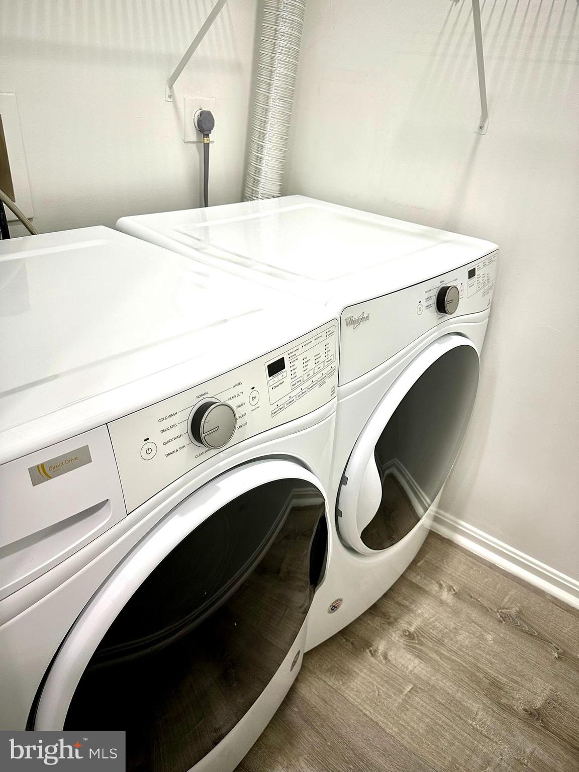 18334 Streamside Drive, Unit 202 Gaithersburg, MD 20879 - Photo 18 of 61 a utility room with dryer and washer