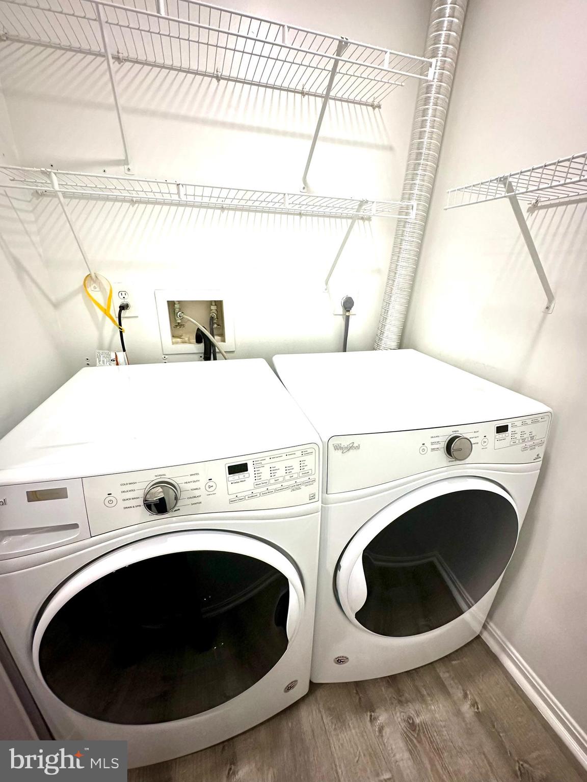 18334 Streamside Drive, Unit 202 Gaithersburg, MD 20879 - Photo 20 of 61 a utility room with dryer and washer