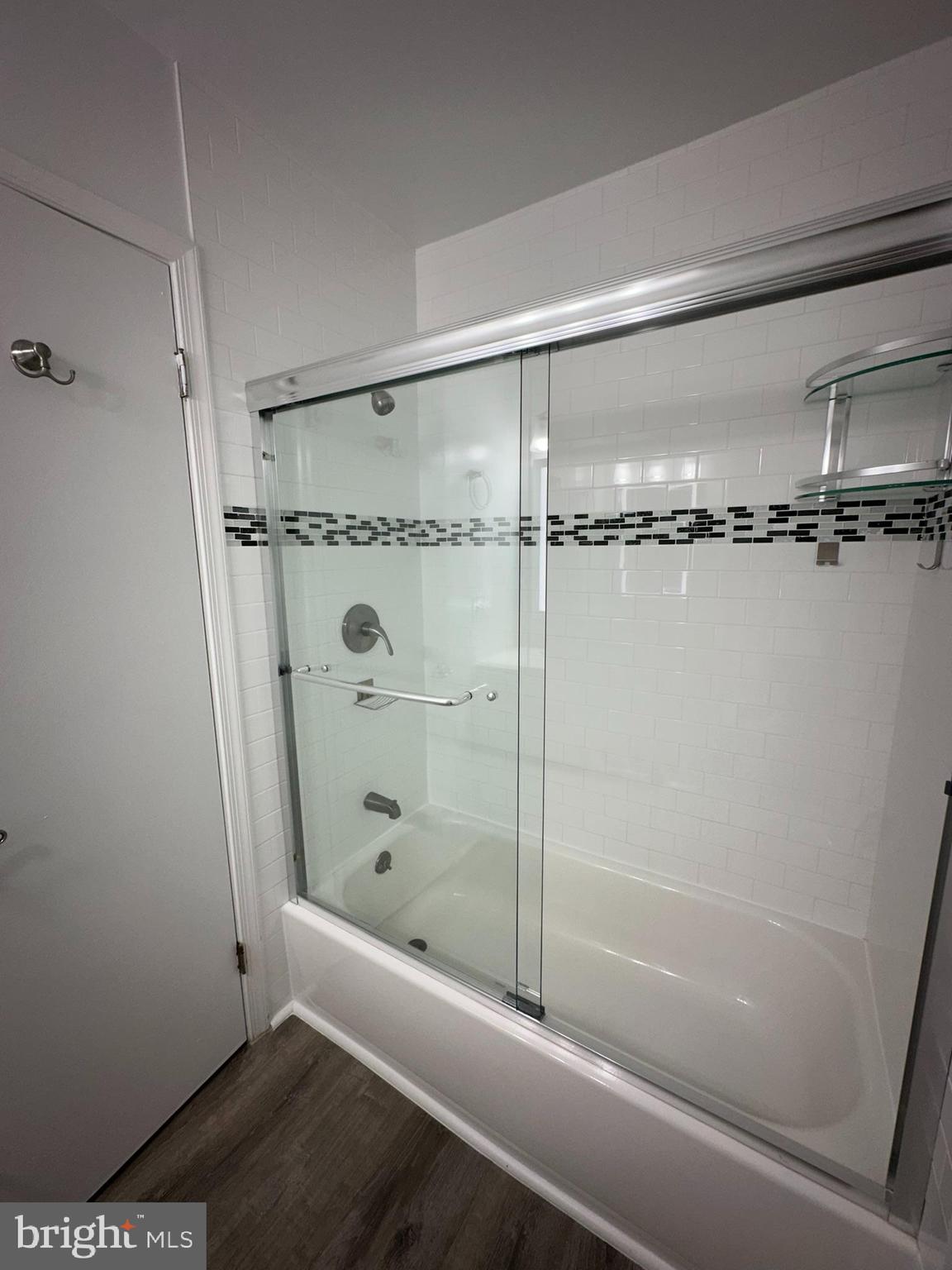18334 Streamside Drive, Unit 202 Gaithersburg, MD 20879 - Photo 37 of 61 a bathroom with a shower and a bath tub