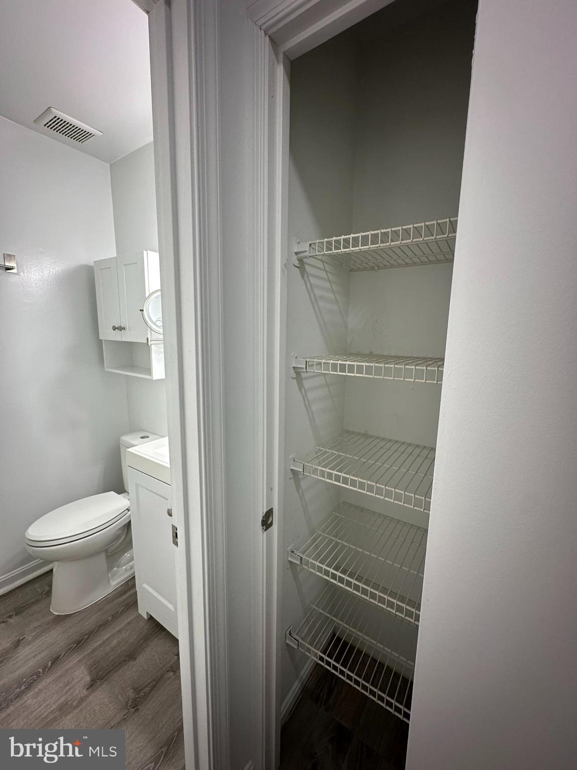 18334 Streamside Drive, Unit 202 Gaithersburg, MD 20879 - Photo 40 of 61 a bathroom with a toilet and a shower