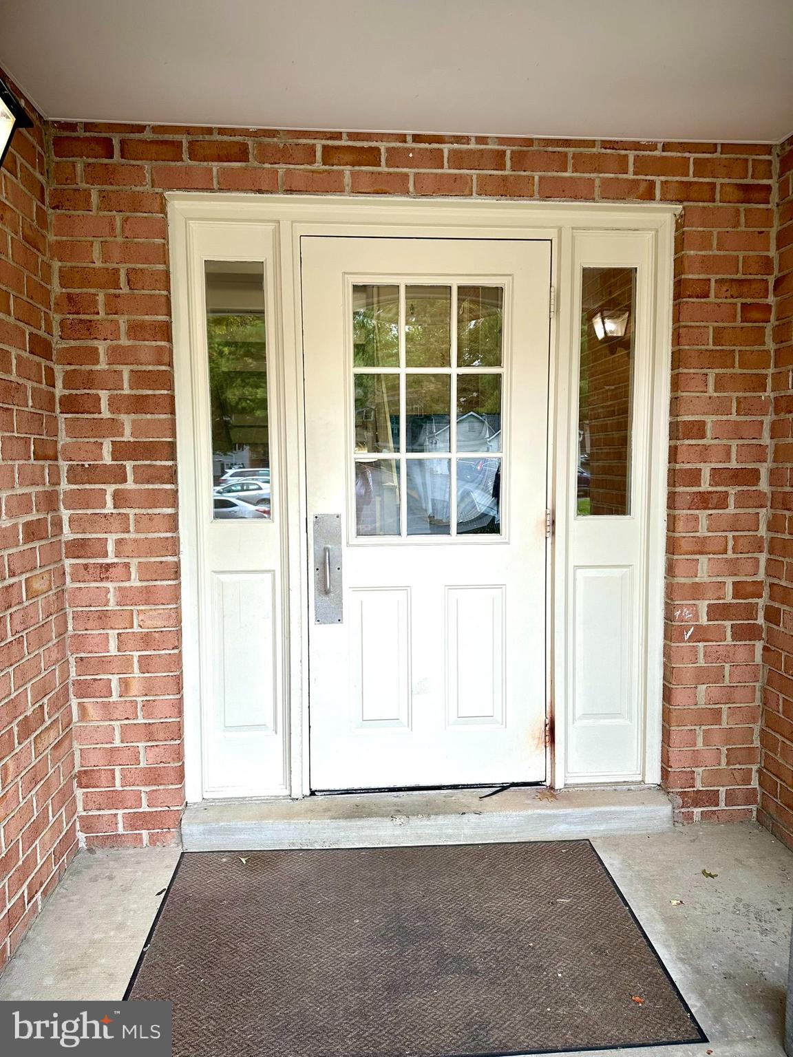 18334 Streamside Drive, Unit 202 Gaithersburg, MD 20879 - Photo 4 of 61 a view of a house with a outdoor space