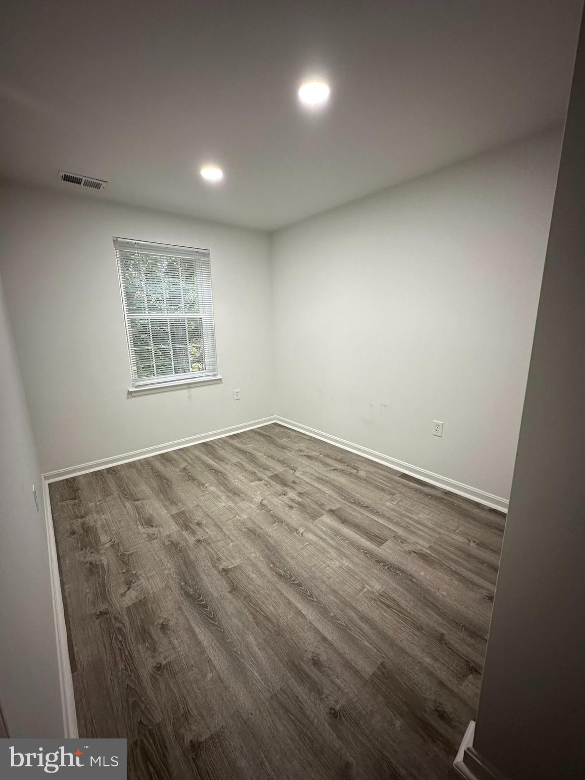 18334 Streamside Drive, Unit 202 Gaithersburg, MD 20879 - Photo 43 of 61 an empty room with a window