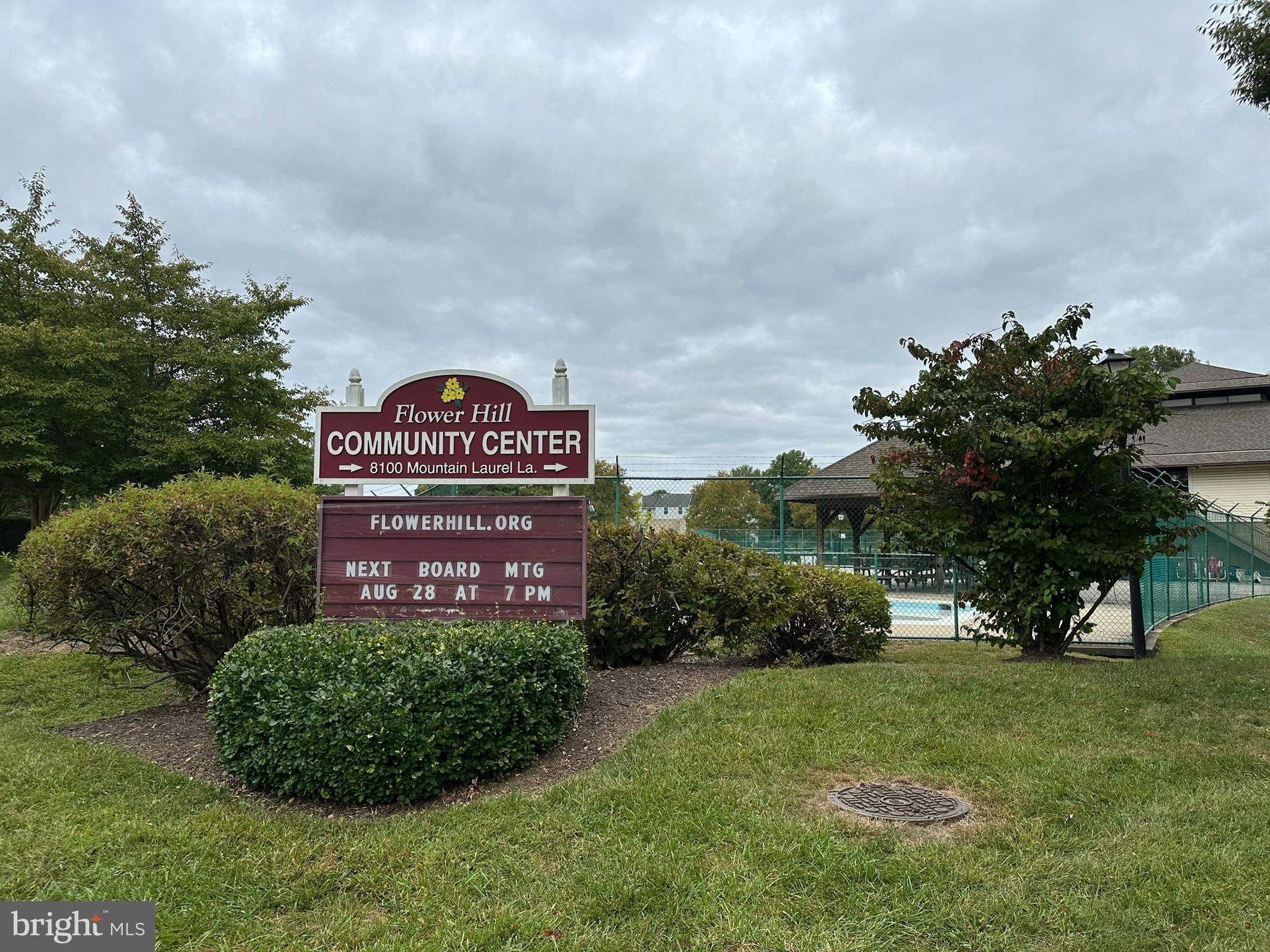 18334 Streamside Drive, Unit 202 Gaithersburg, MD 20879 - Photo 50 of 61 a sign board with a house in the background