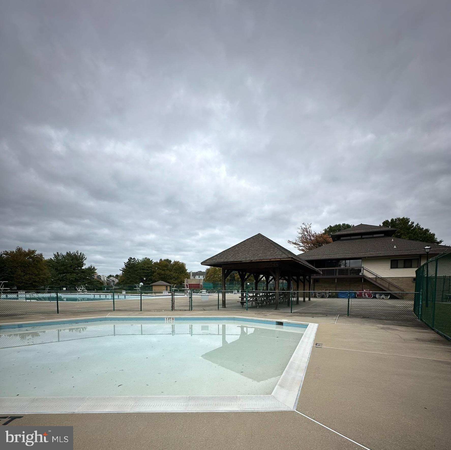 18334 Streamside Drive, Unit 202 Gaithersburg, MD 20879 - Photo 52 of 61 a view of yard with swimming pool and furniture