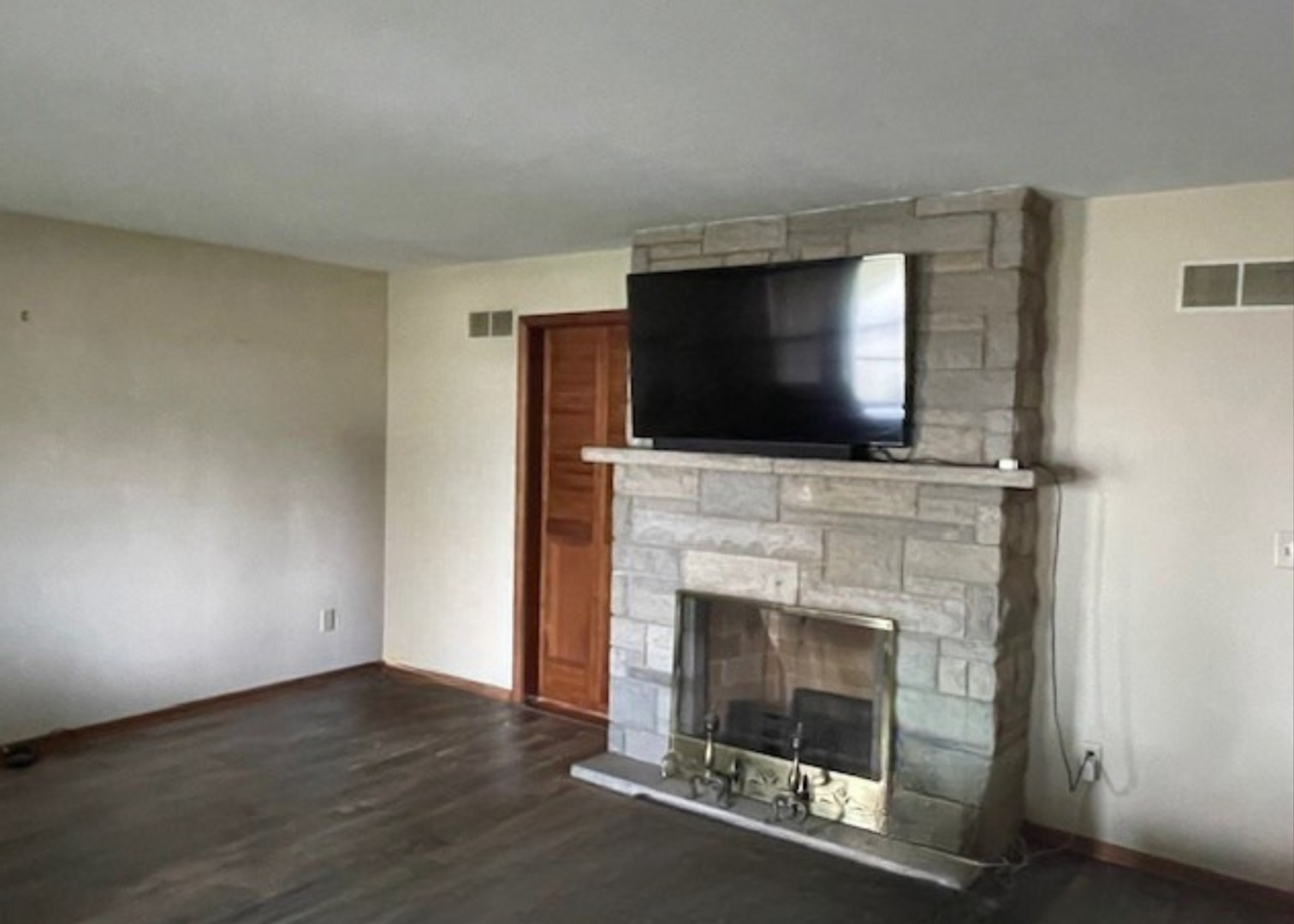 802 Westminster Road Joliet, IL 60435 - Photo 3 of 15 a living room with a fireplace and a flat screen tv