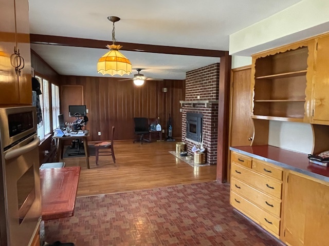 802 Westminster Road Joliet, IL 60435 - Photo 6 of 15 a living room with furniture a dining table and a piano table