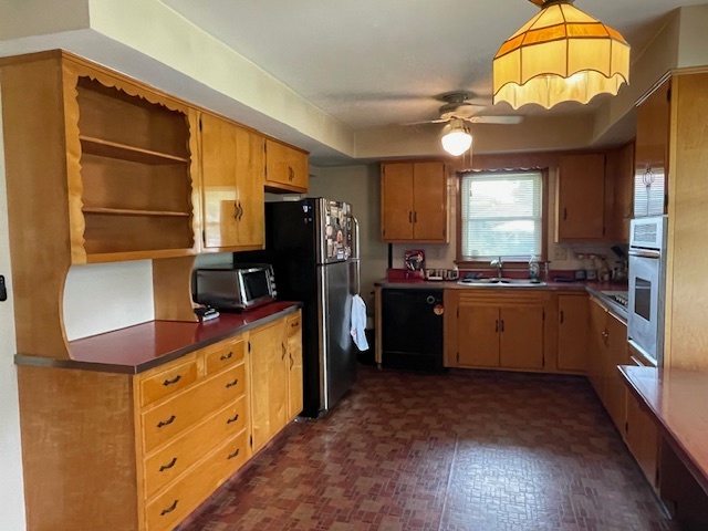 802 Westminster Road Joliet, IL 60435 - Photo 7 of 15 a kitchen with stainless steel appliances kitchen island granite countertop a refrigerator a stove and a sink