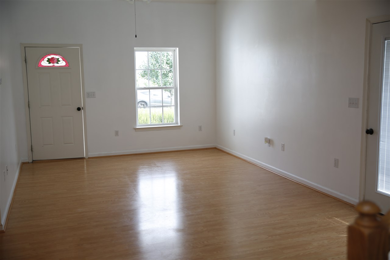 201 Rutledge Drive Waynesboro, VA 22980 - Photo 17 of 18 an empty room with wooden floor and windows