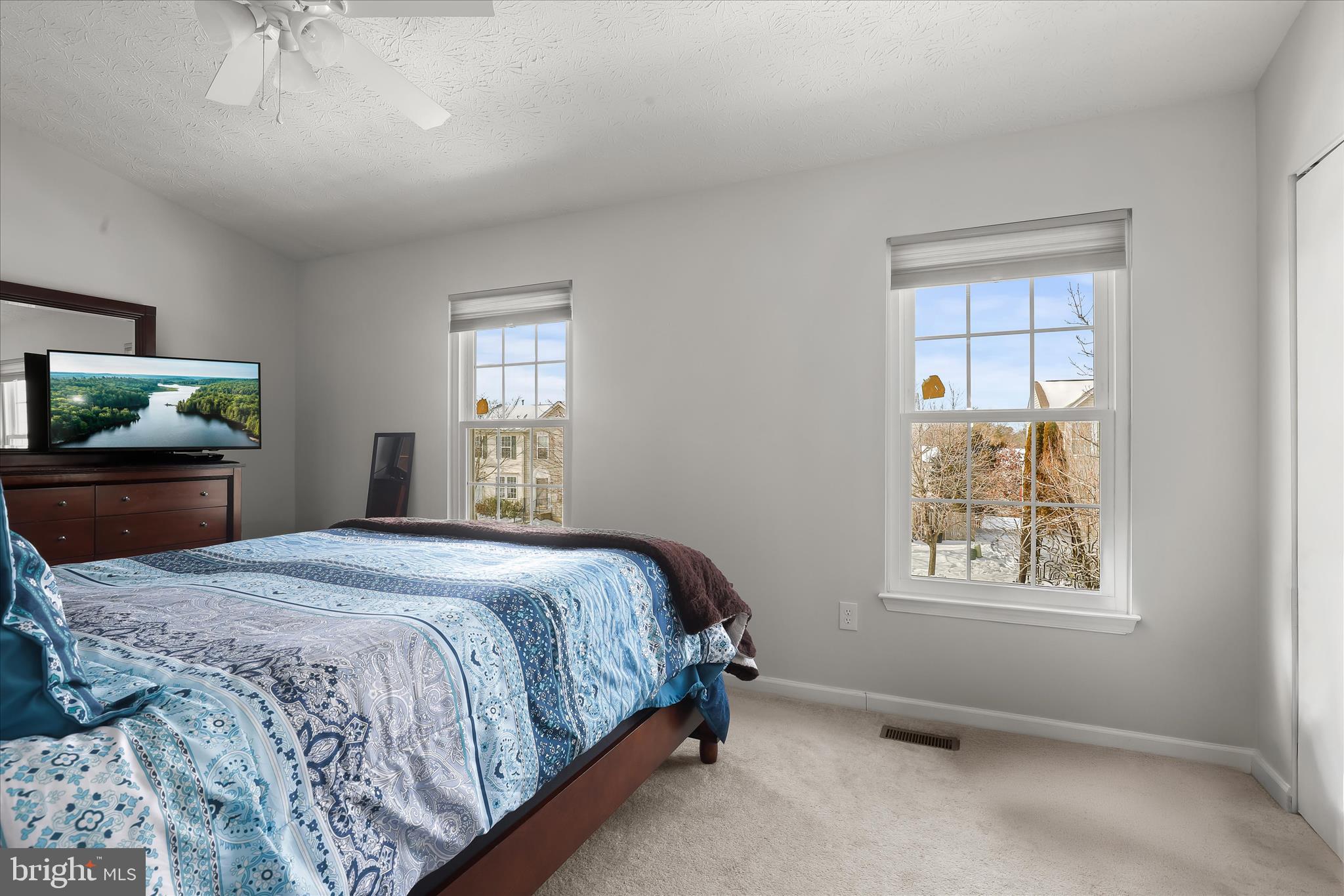 2019 Amber Way Baltimore, MD 21244 - Photo 11 of 27 a bedroom with a bed and a flat screen tv