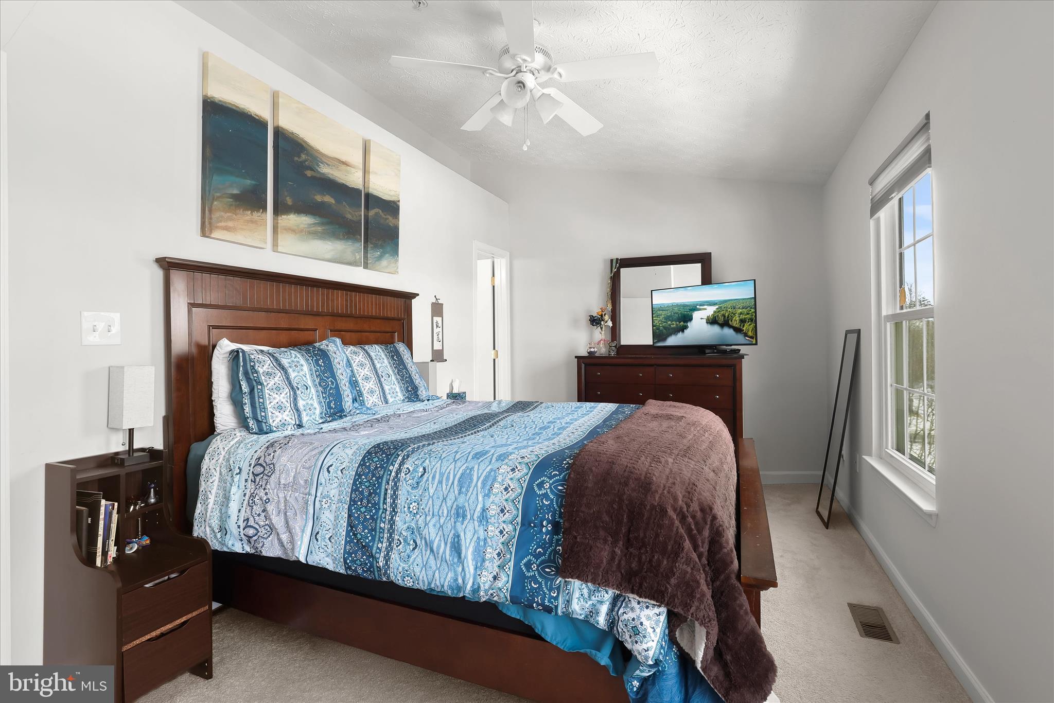 2019 Amber Way Baltimore, MD 21244 - Photo 12 of 27 a bedroom with a bed a dresser and window