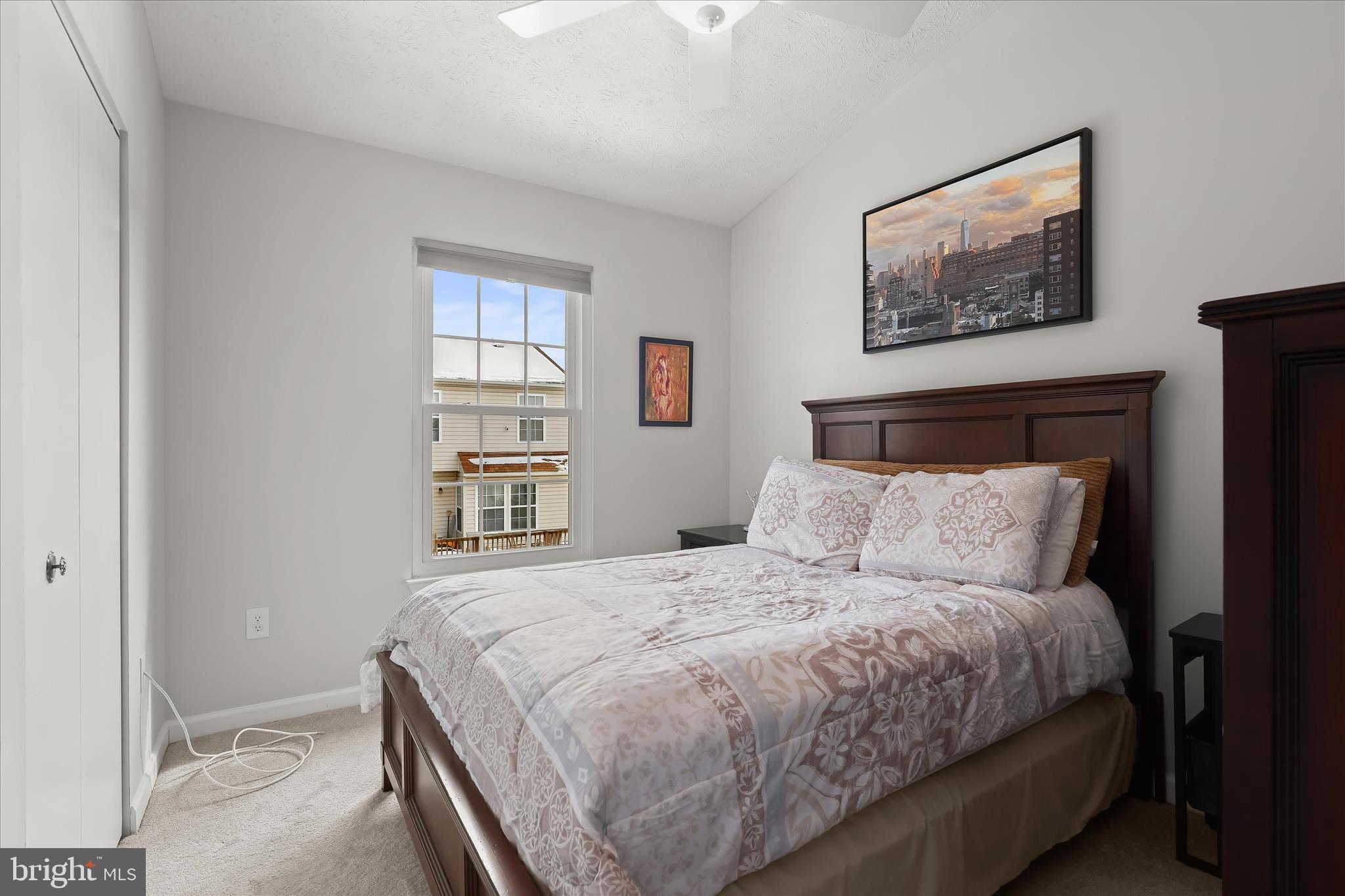 2019 Amber Way Baltimore, MD 21244 - Photo 15 of 27 a bedroom with a large bed and a window