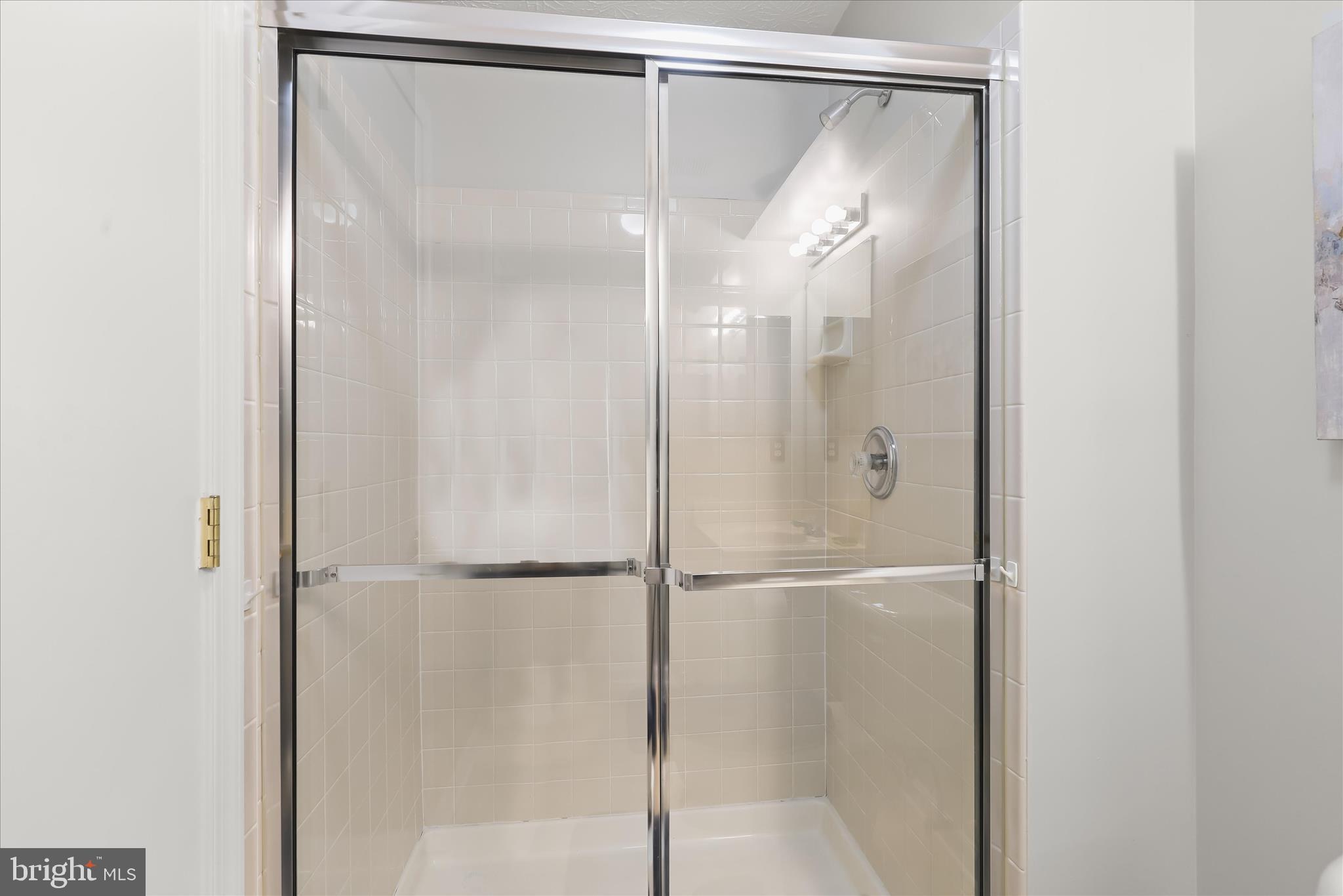 2019 Amber Way Baltimore, MD 21244 - Photo 20 of 27 a bathroom that has a glass shower door
