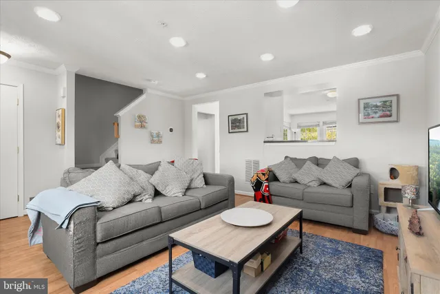 a living room with furniture and a table