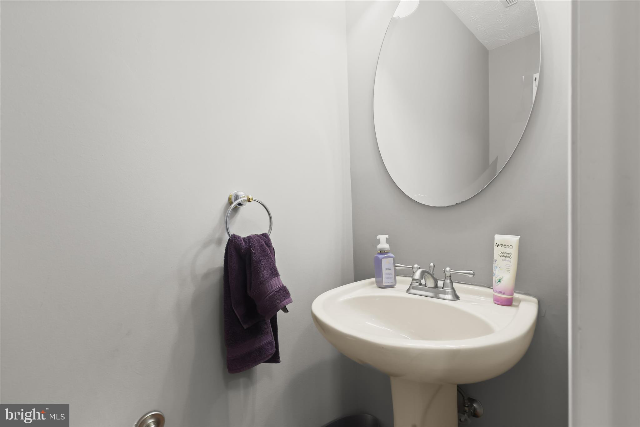 2019 Amber Way Baltimore, MD 21244 - Photo 10 of 27 a bathroom with a sink a mirror and vanity