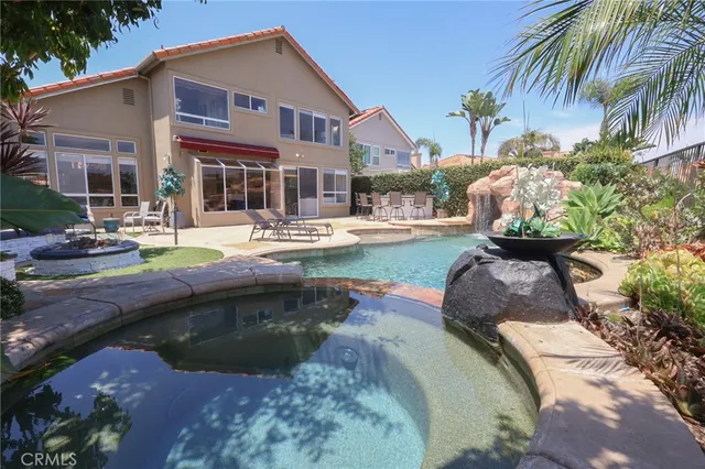 a front view of a house with swimming pool