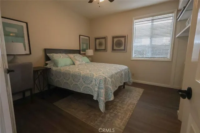 a bed sitting in a bedroom next to a window