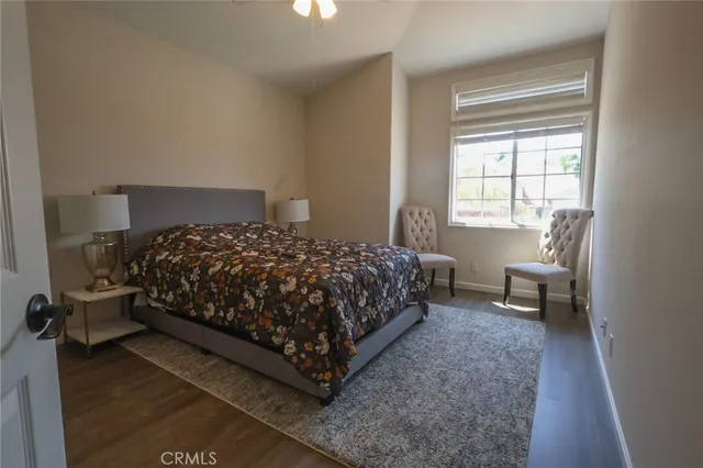 a bedroom with a bed and a couch