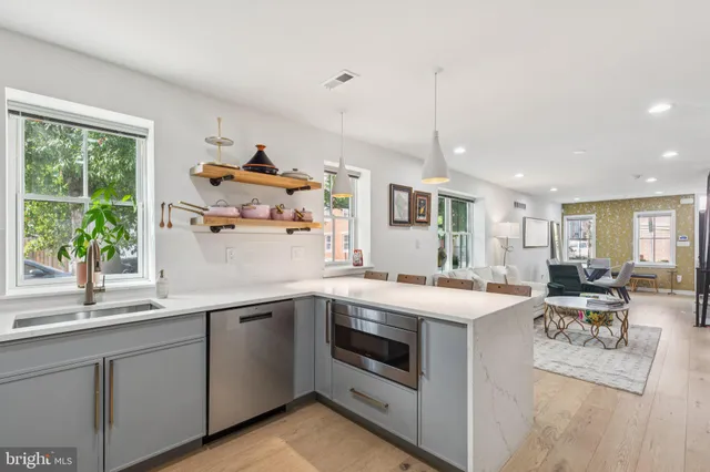 a kitchen with a sink stove and cabinets