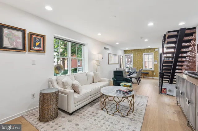 a living room with furniture and a large window