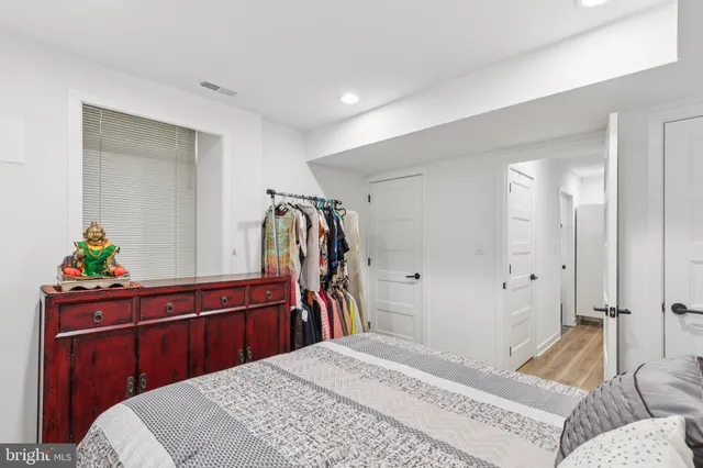 a bedroom with a bed and a closet