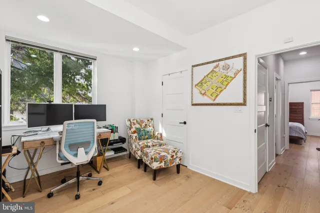 a bedroom with furniture and a window