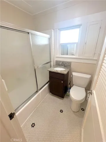 a bathroom with a toilet a sink and a bathtub
