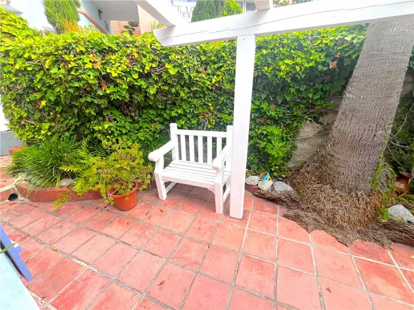 a view of a bench in the backyard