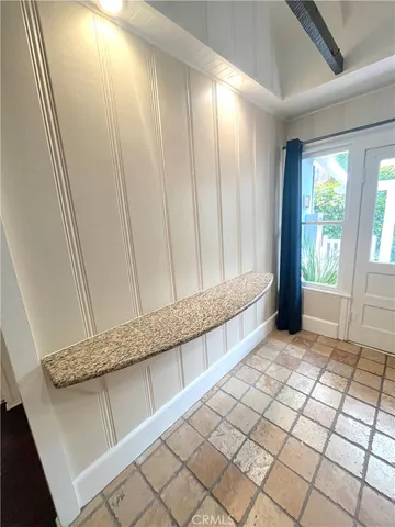 a view of a utility room with windows