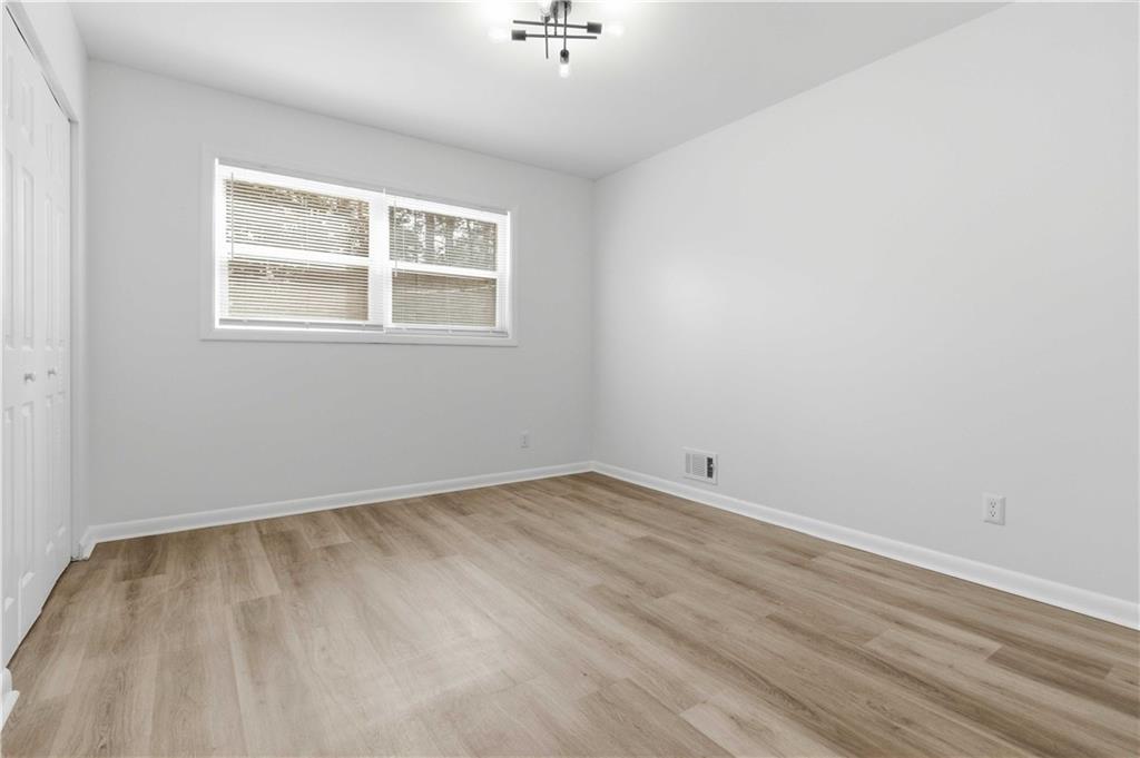 2275 Country Club Lane Southwest Atlanta, GA 30311 - Photo 12 of 32 a view of an empty room with a window