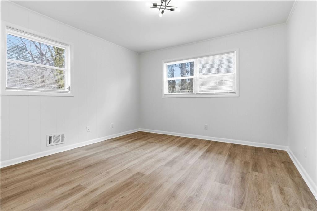 2275 Country Club Lane Southwest Atlanta, GA 30311 - Photo 14 of 32 a view of empty room with wooden floor and fan