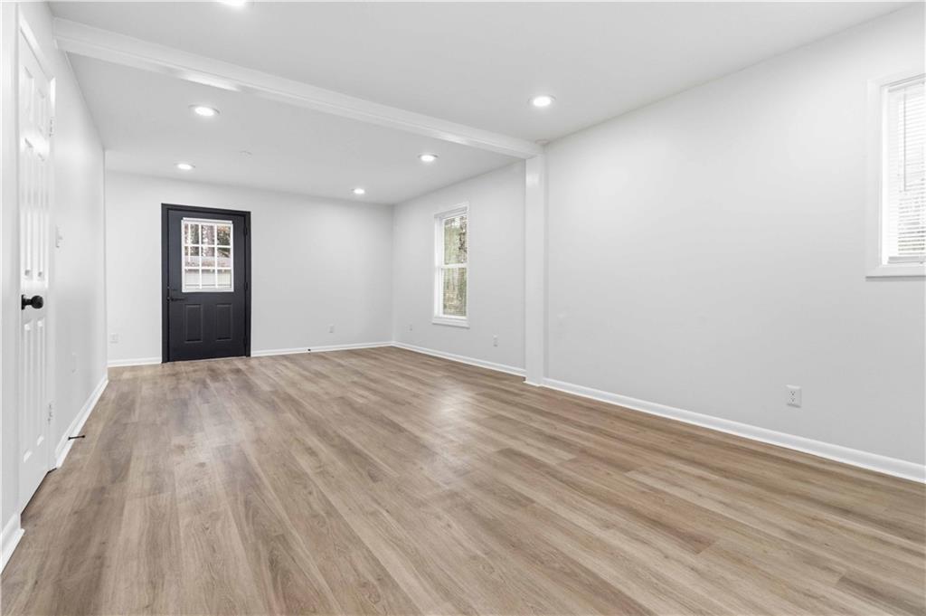 2275 Country Club Lane Southwest Atlanta, GA 30311 - Photo 16 of 32 a view of empty room with wooden floor