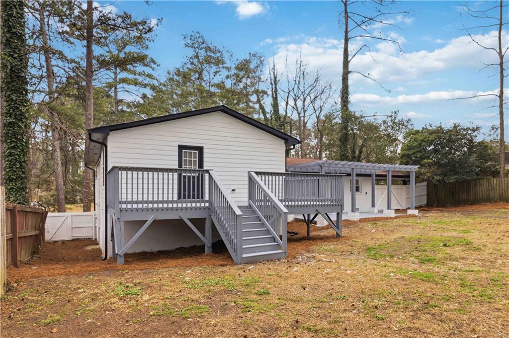 2275 Country Club Lane Southwest Atlanta, GA 30311 - Photo 27 of 32 a view of a house with a yard deck and furniture