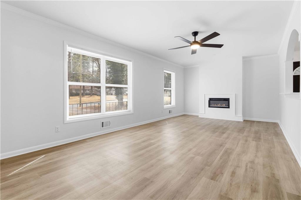 2275 Country Club Lane Southwest Atlanta, GA 30311 - Photo 5 of 32 a view of empty room with wooden floor and fan