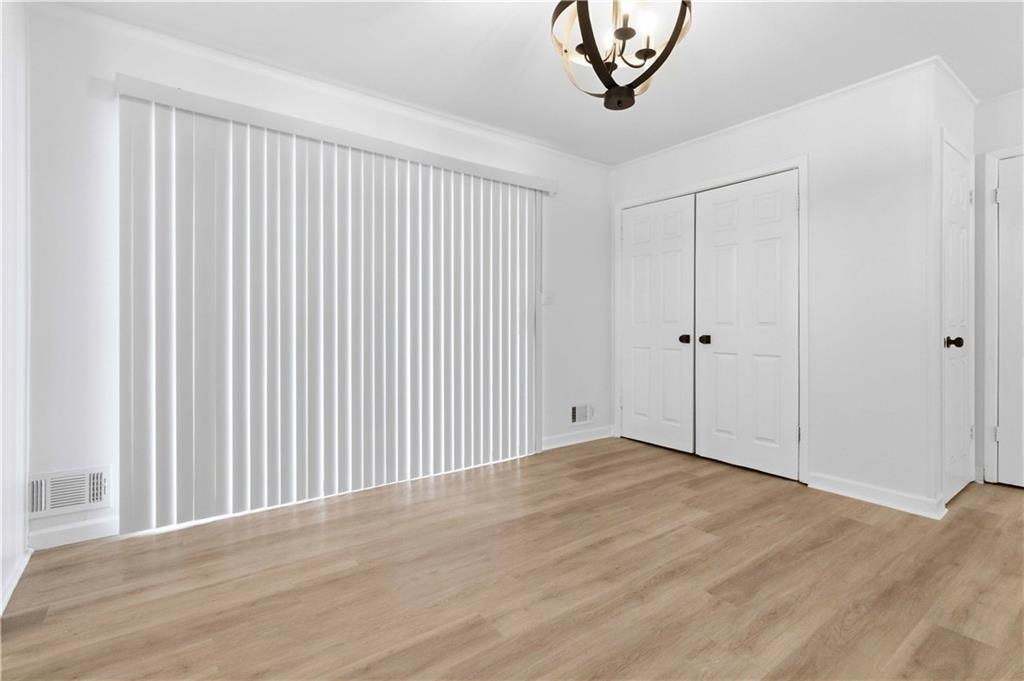 2275 Country Club Lane Southwest Atlanta, GA 30311 - Photo 8 of 32 a view of an empty room with a window