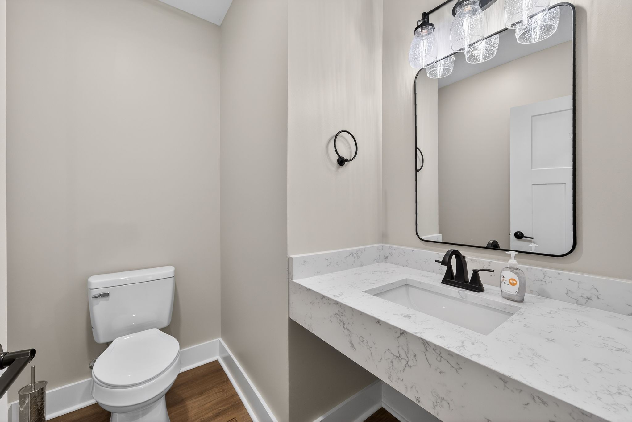 424 Centre Street Pleasant View, TN 37146 - Photo 9 of 36 a bathroom with a granite countertop sink a toilet and a mirror