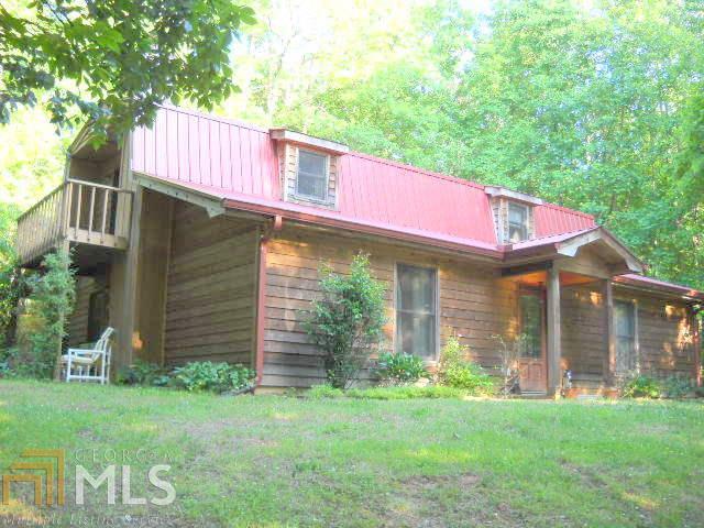 5255 Duncan Bridge Road Southwest, Unit 17 Cornelia, GA 30531 - Photo 1 of 1 a front view of a house with a garden