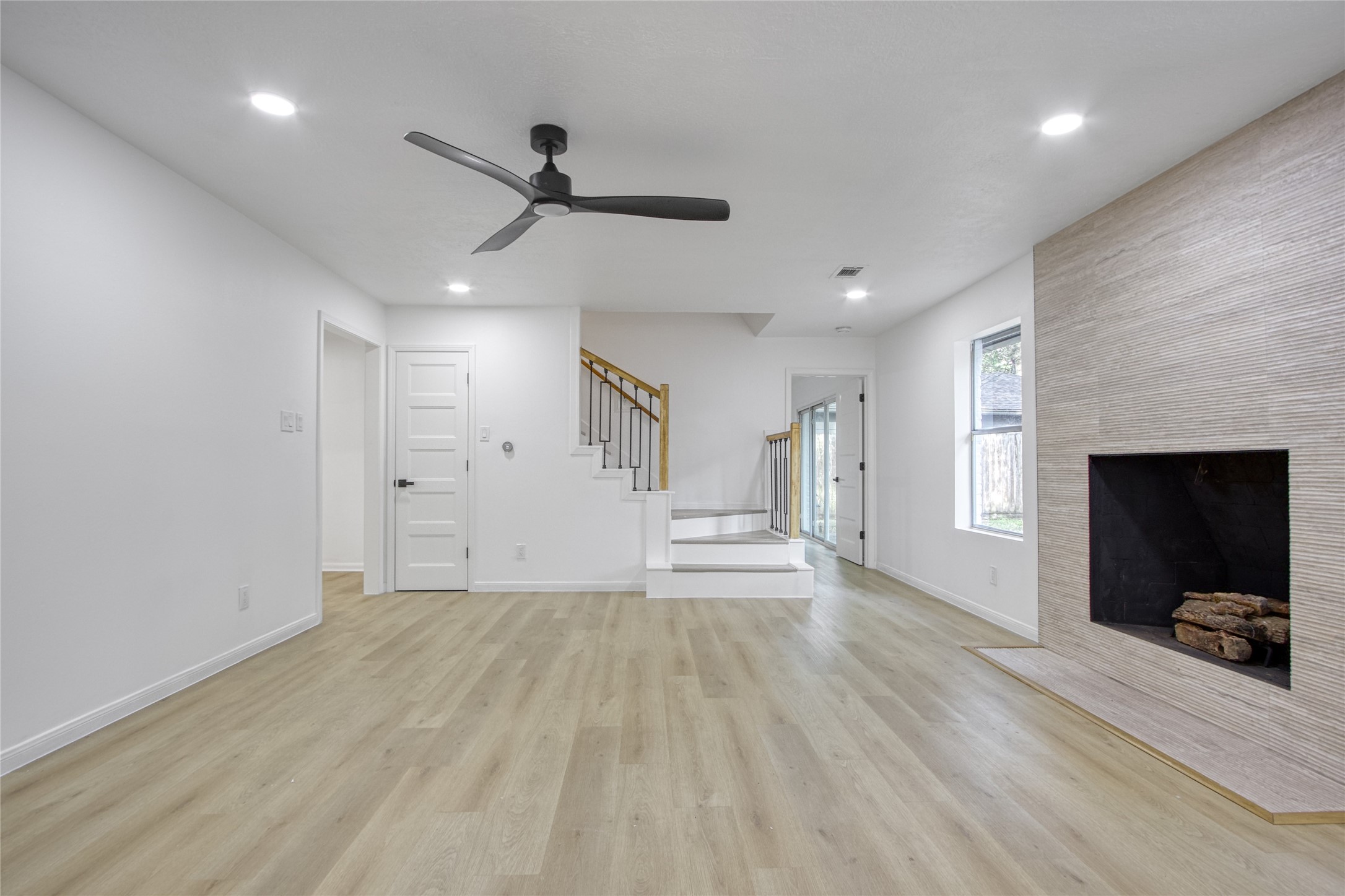 9211 Godstone Lane Spring, TX 77379 - Photo 11 of 30 a view of empty room with wooden floor and fan