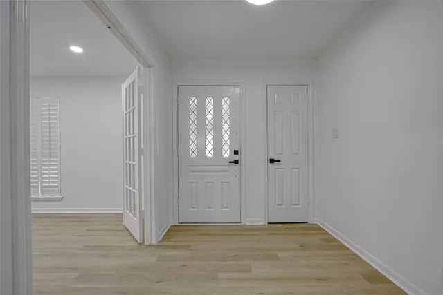 a view of wooden floor in an empty room